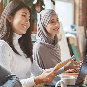 Two women discussing assessments